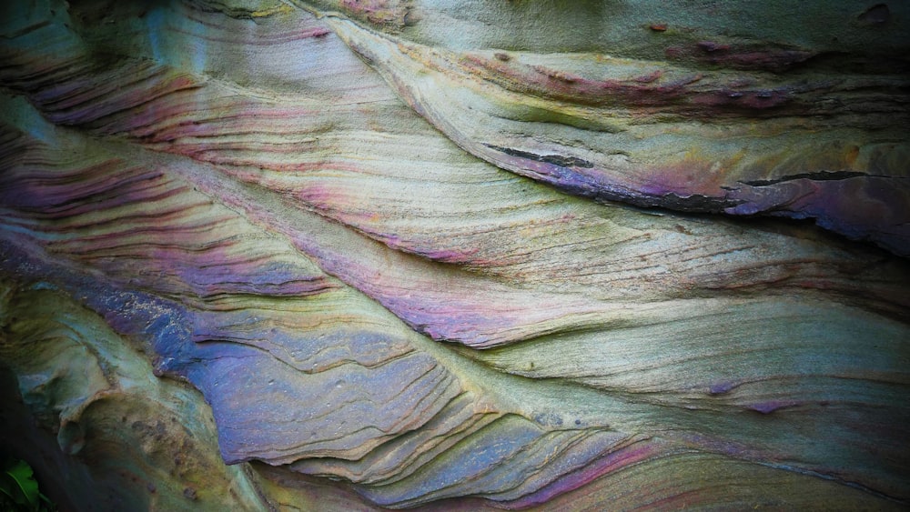 a close up of a rock formation with different colors