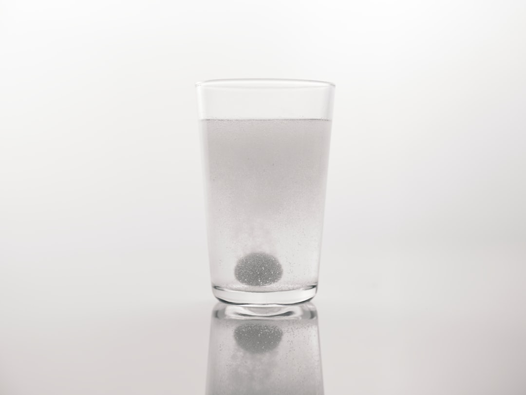 a medicine dissolved in a glass of water