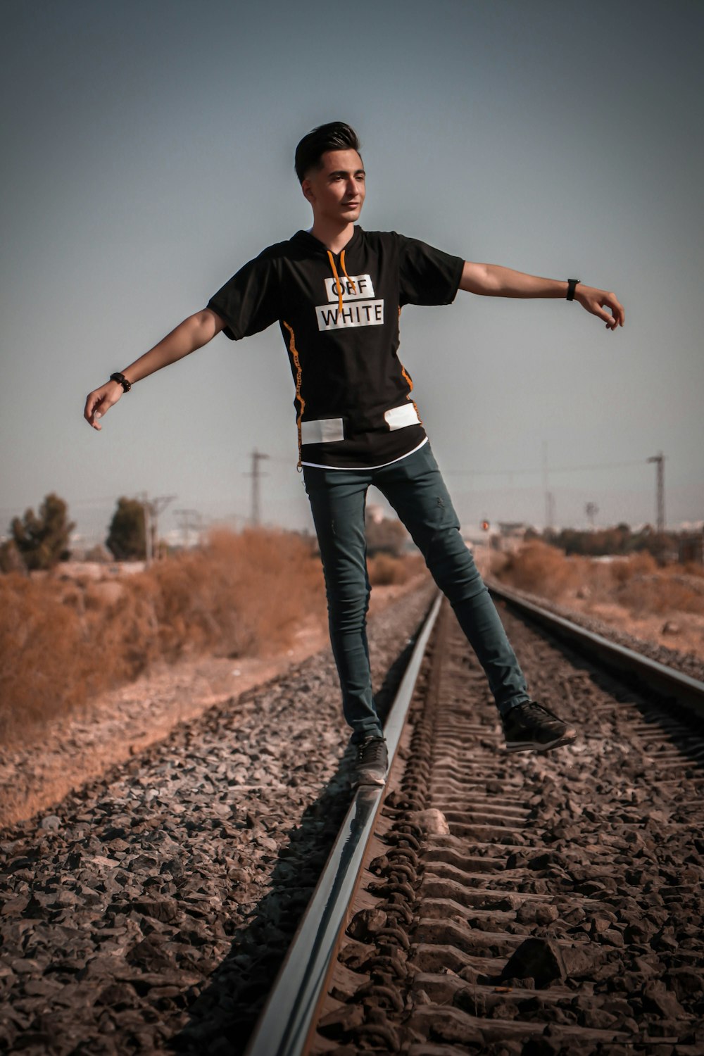 a man is standing on a train track