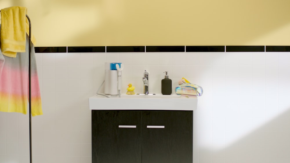 a bathroom with a sink and a towel on a rack