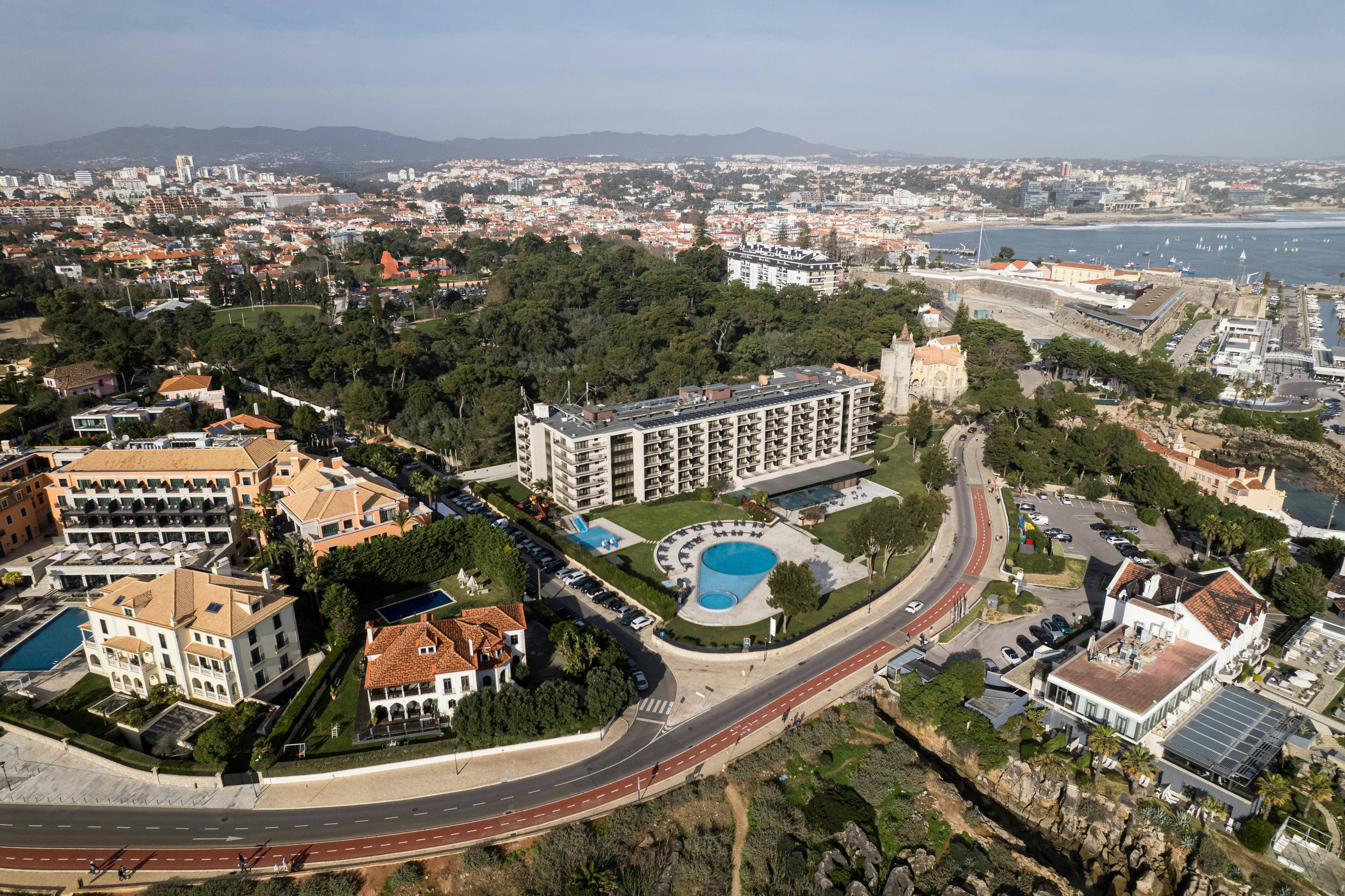 a bird's eye view of a city with a swimming pool