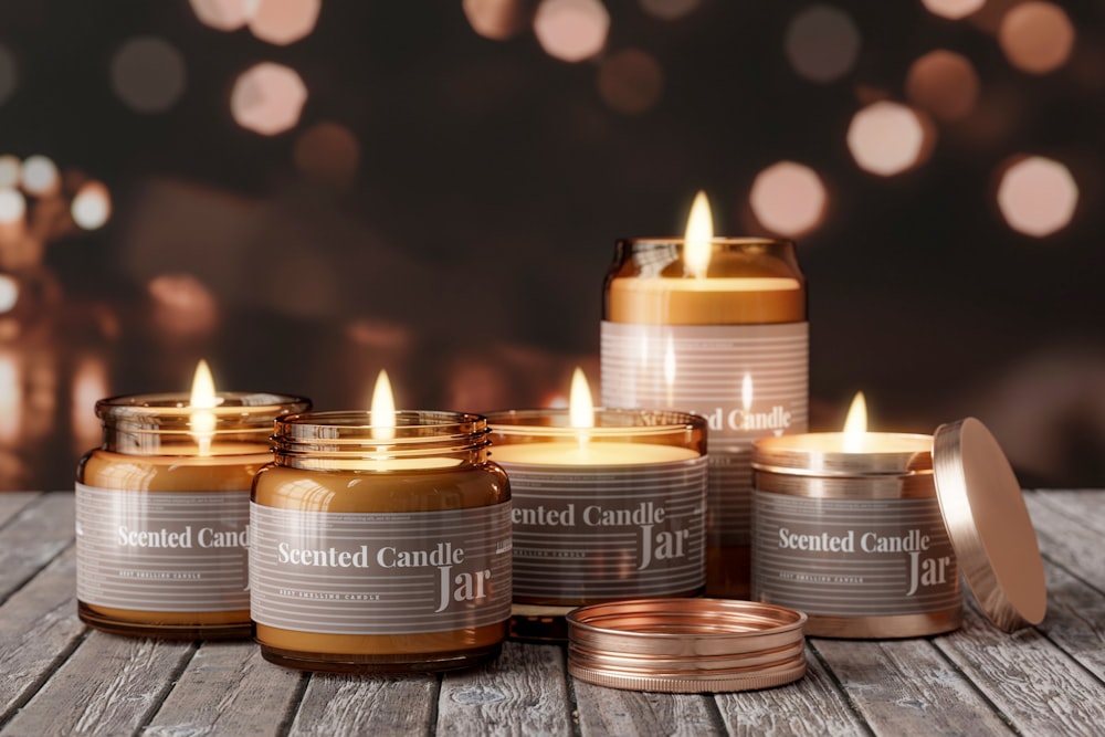 a group of candles sitting on top of a wooden table