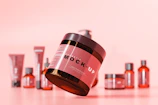 A vibrant display of cosmetic products with colorful packaging on a clean background.