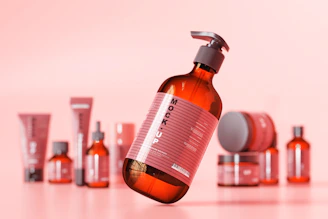 Close-up of vibrant cosmetic raw materials in small glass containers on a wooden table.