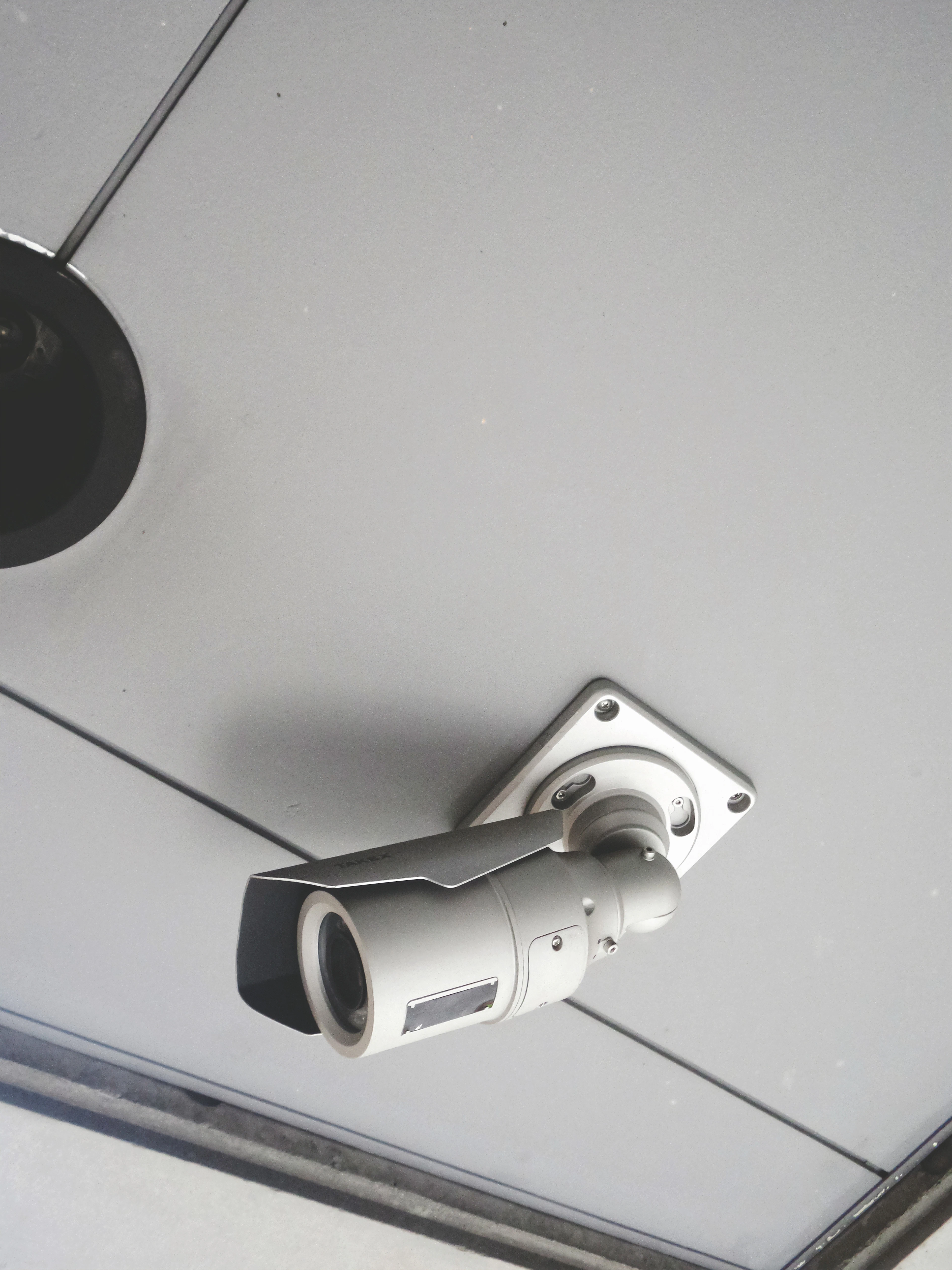 Ceiling-mounted security camera inside a building