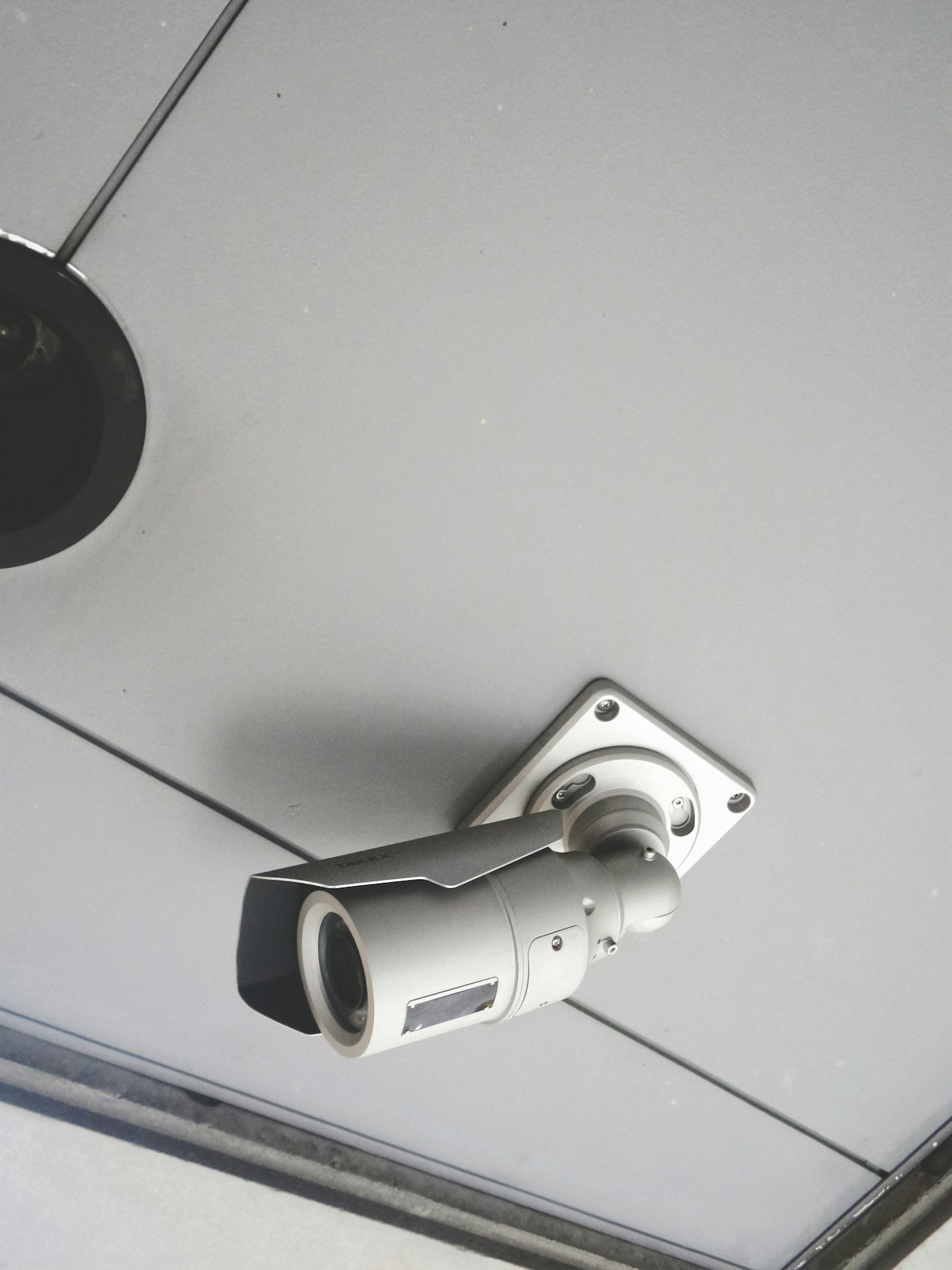 IP camera mounted under a ceiling eave