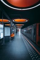 a train station with a train parked next to it