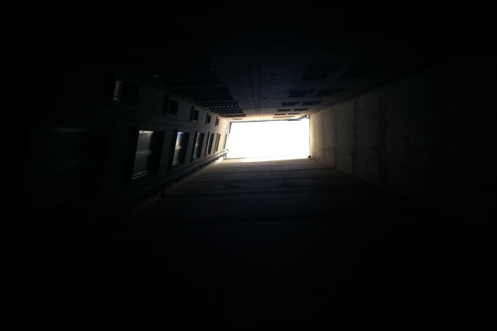 a dark tunnel with a light at the end