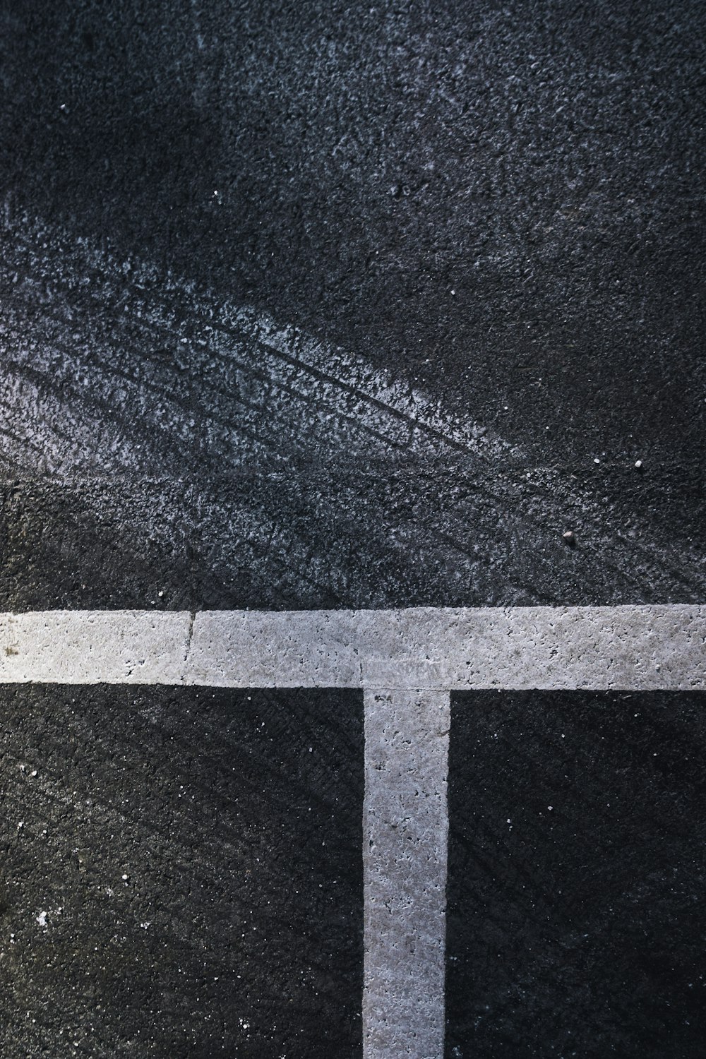 an overhead view of a street with white lines