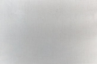 a black and white photo of a white wall