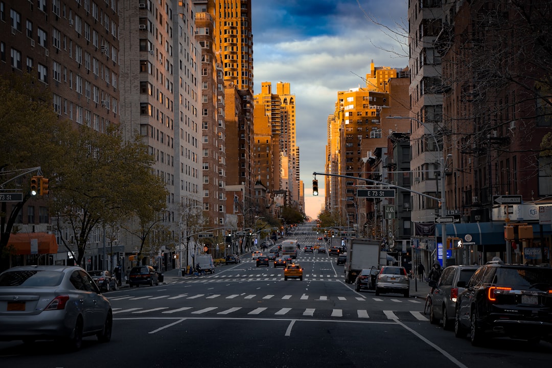 a city street filled with lots of tall buildings, Looking up Third Ave on the Upper East Side.