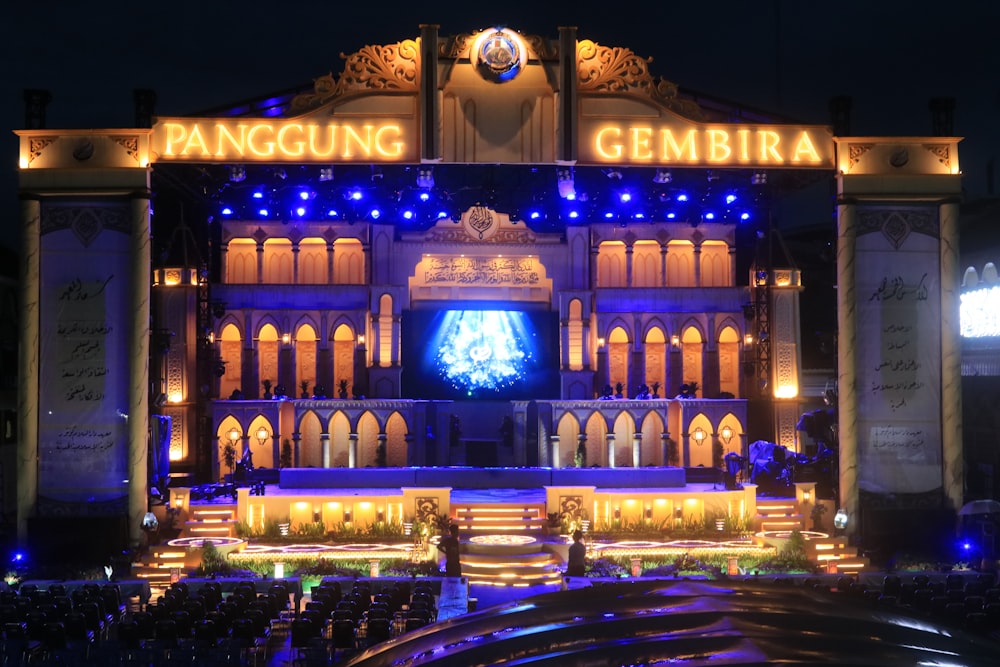 a large building lit up at night with lights