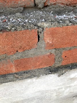 Close-up of a building defect being identified during an inspection.