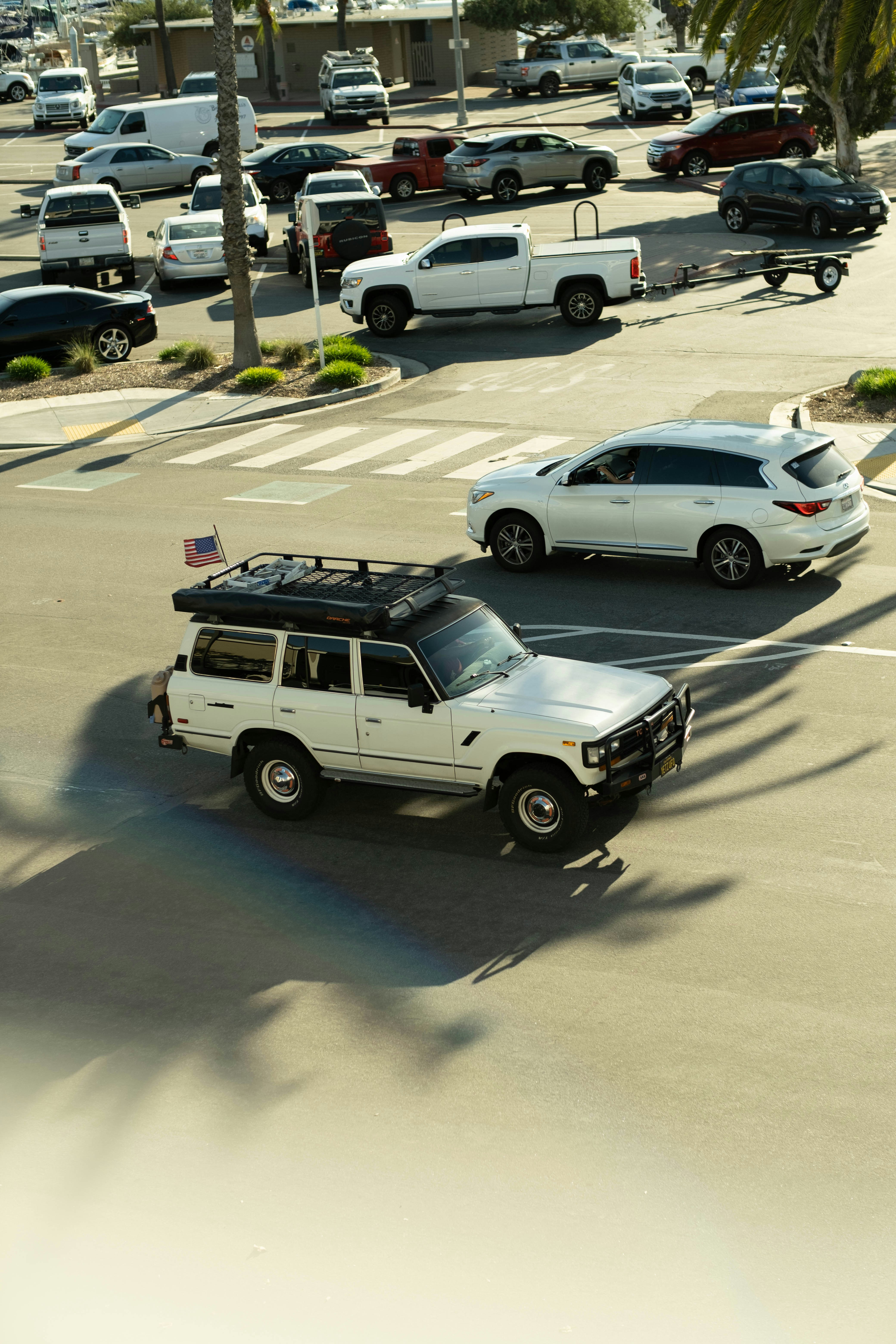 a parking lot filled with lots of parked cars