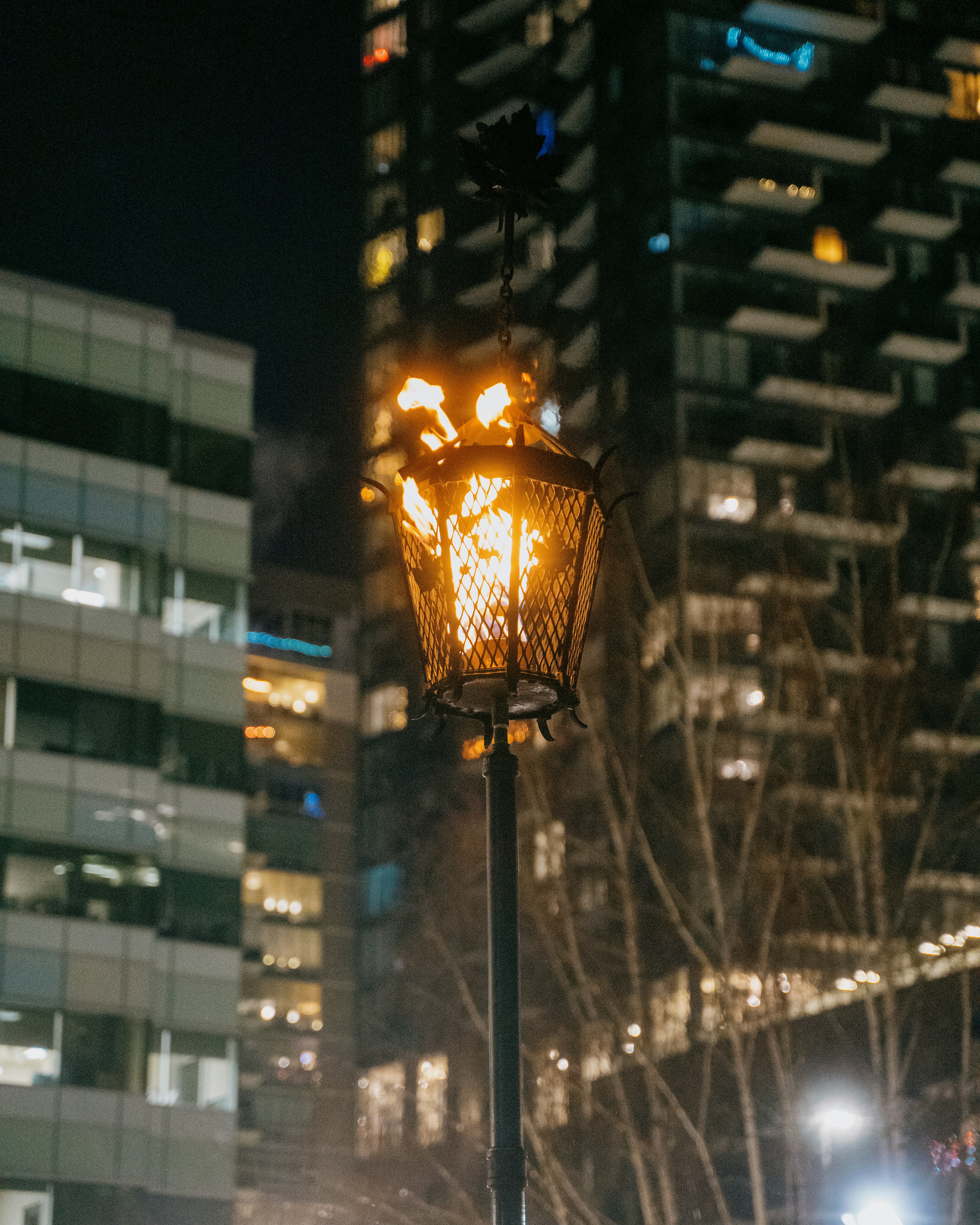 a street light with a building in the background