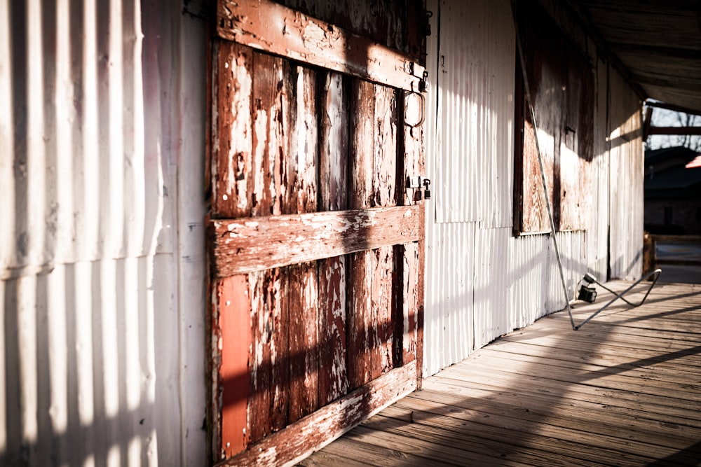 an old wooden door on a white building