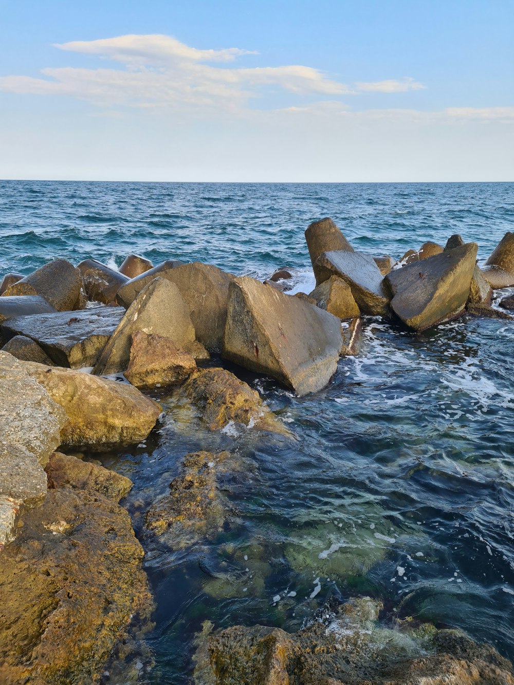 a large body of water surrounded by rocks