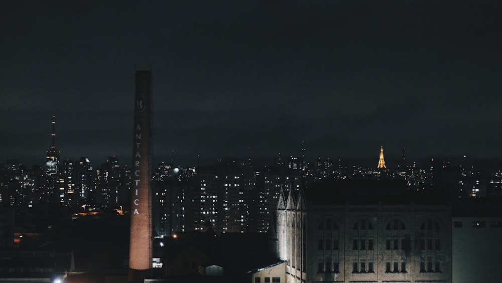 a view of a city at night from a rooftop