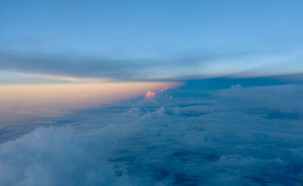 a view of the clouds from an airplane window