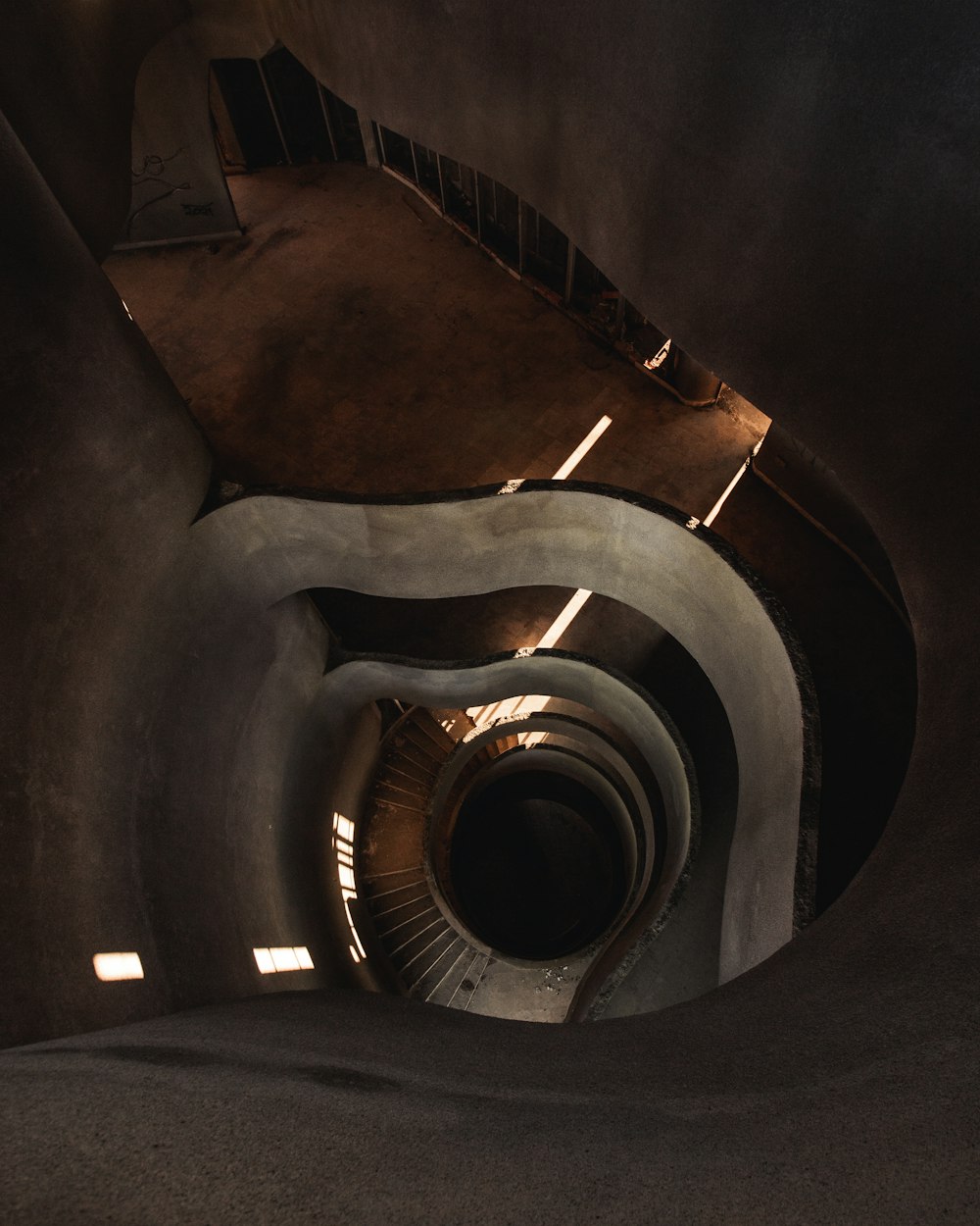 a spiral staircase in a concrete building