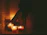 A serene spa room bathed in soft candlelight with plush towels and aromatic oils.