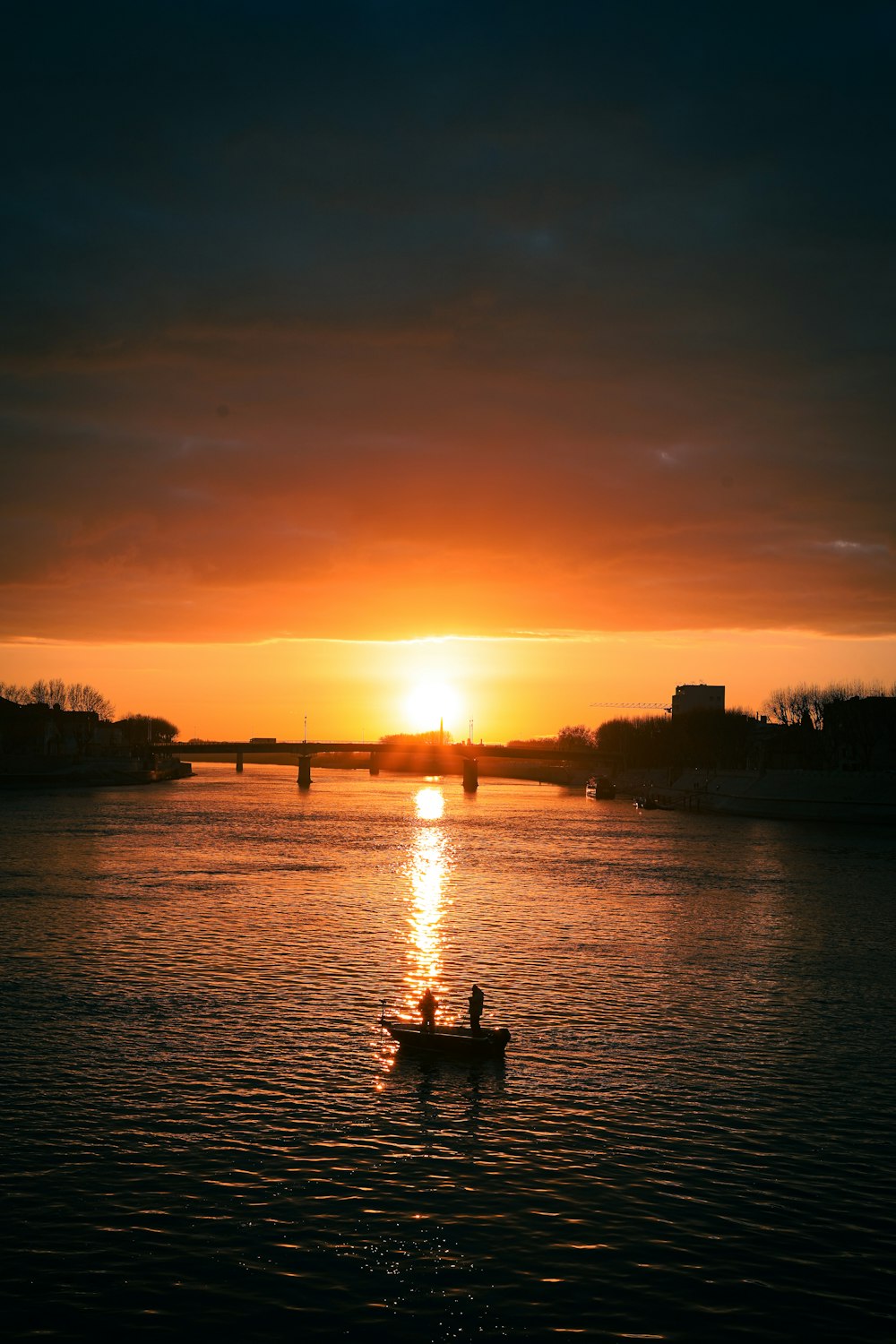 a person in a small boat on a body of water