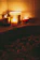 A serene spa room bathed in soft rose gold light with candles flickering gently.