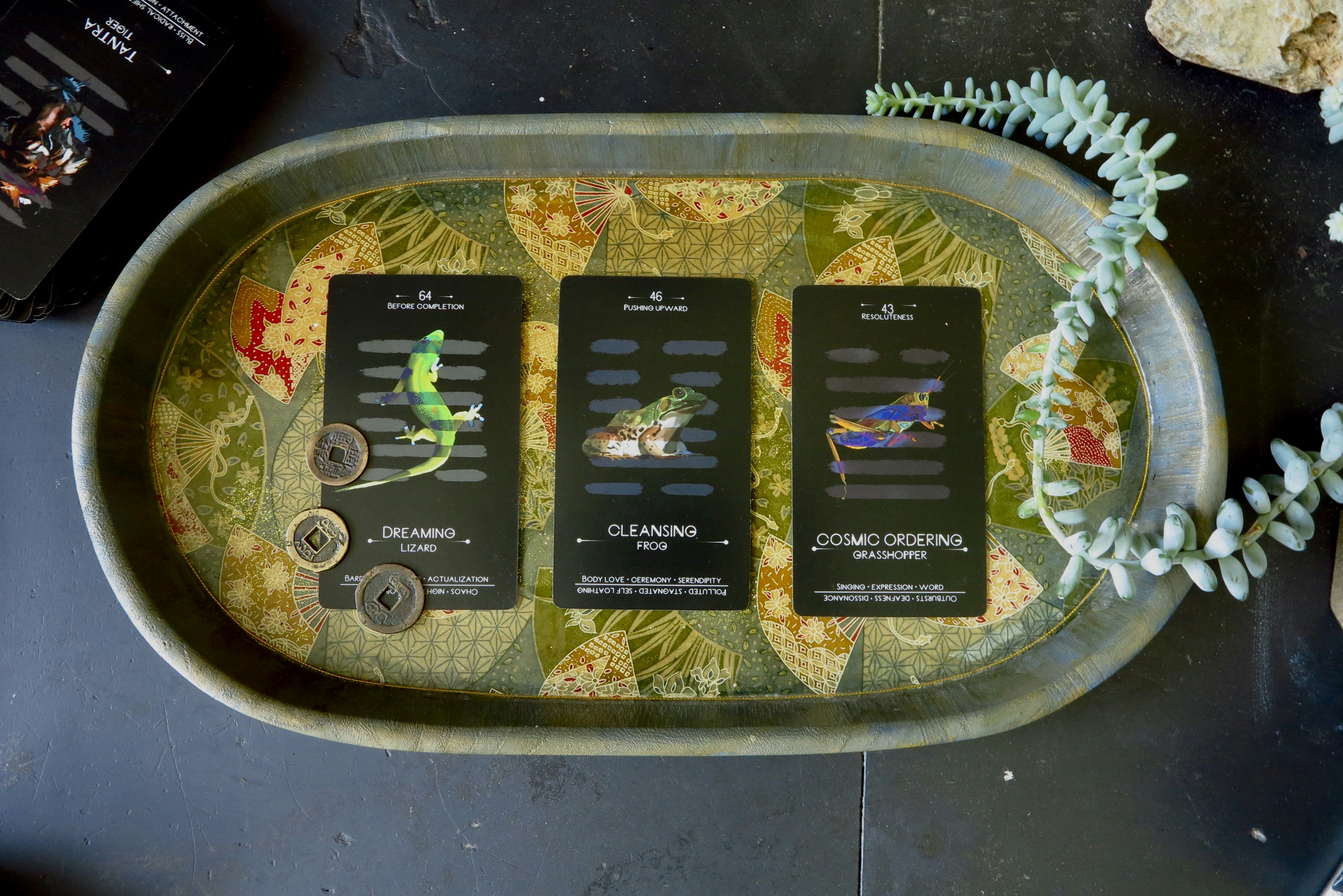 three remote controls sitting on top of a metal tray