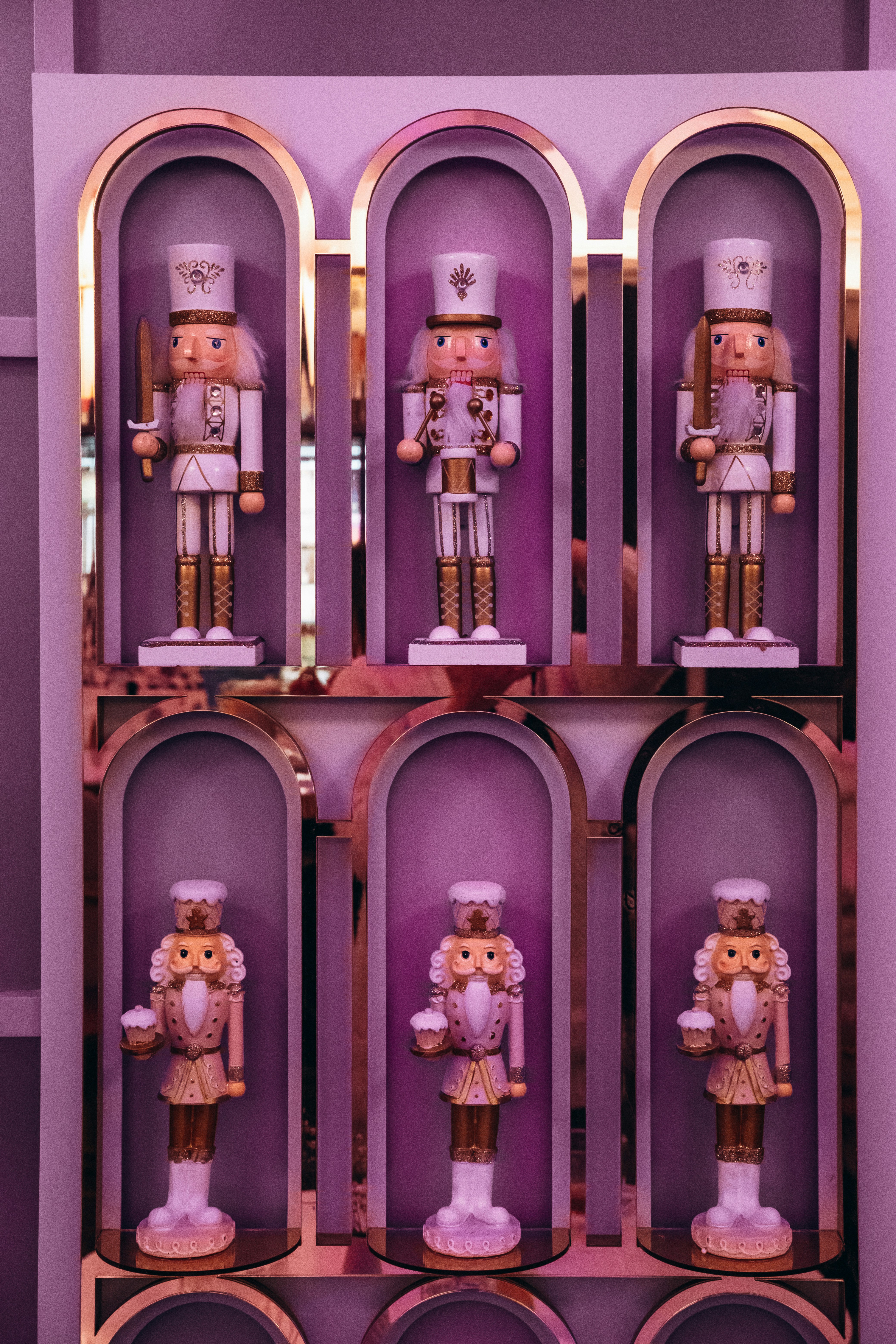 a shelf with a bunch of nutcrackers on it