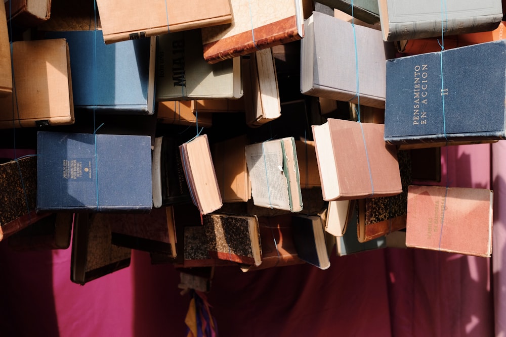 a bunch of books that are stacked on top of each other