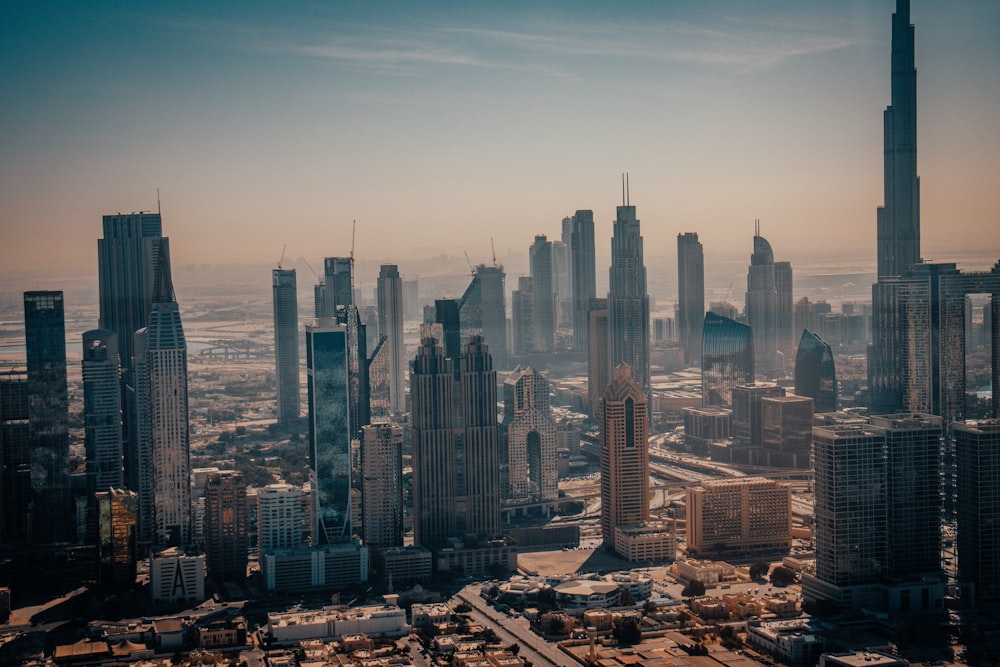 an aerial view of a city with tall buildings