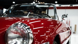 a close up of the front of a red sports car