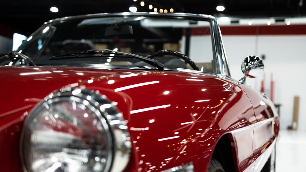 a close up of the front of a red sports car