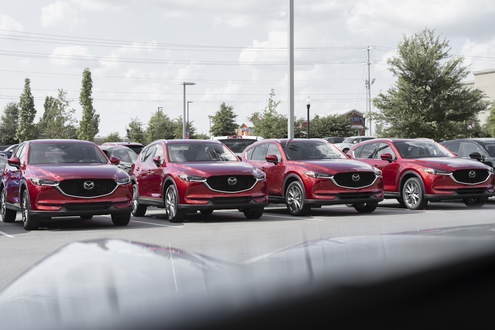 a row of cars parked in a parking lot