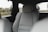 the back seats of a car with a view of a field