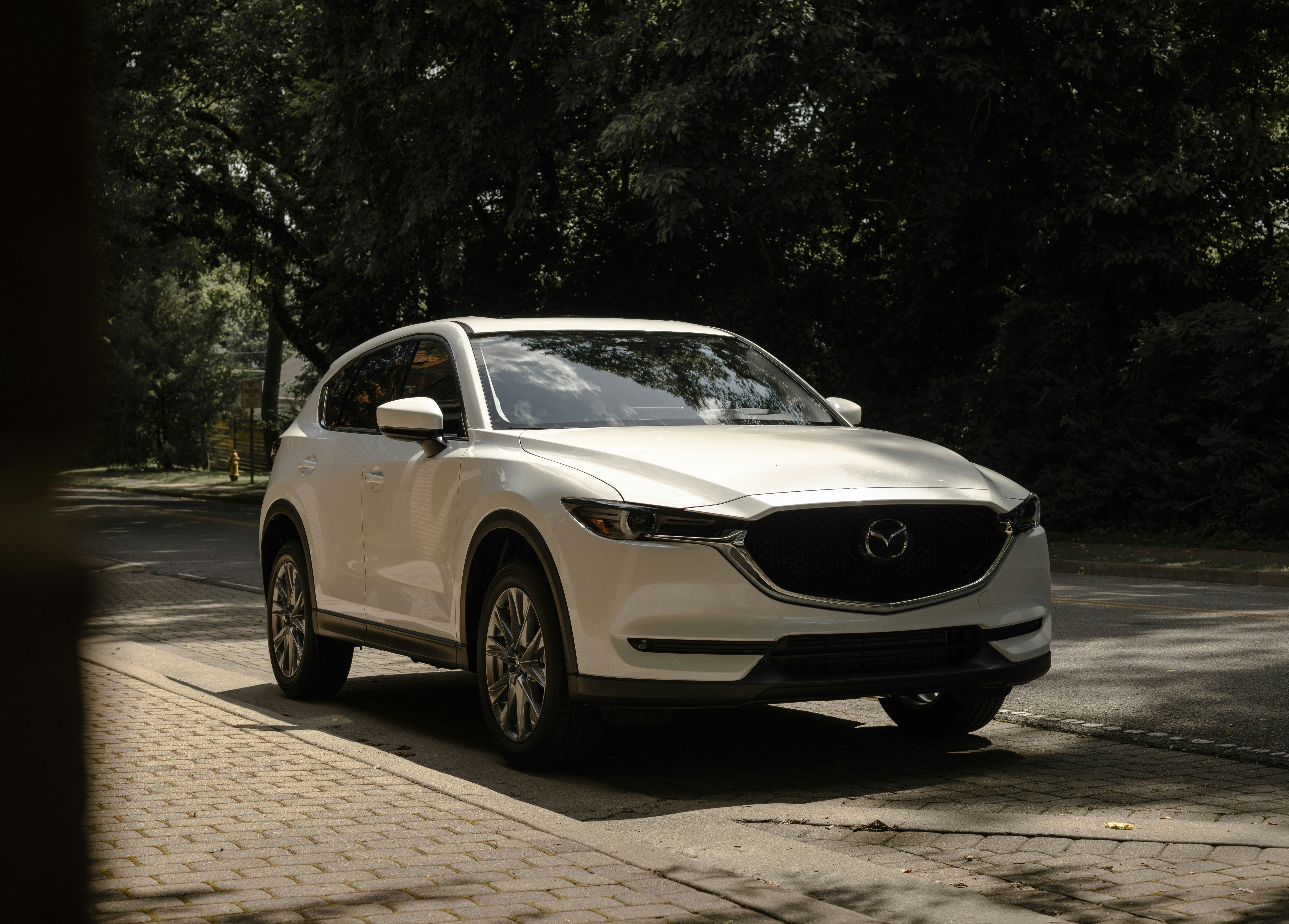 a white car parked on the side of the road