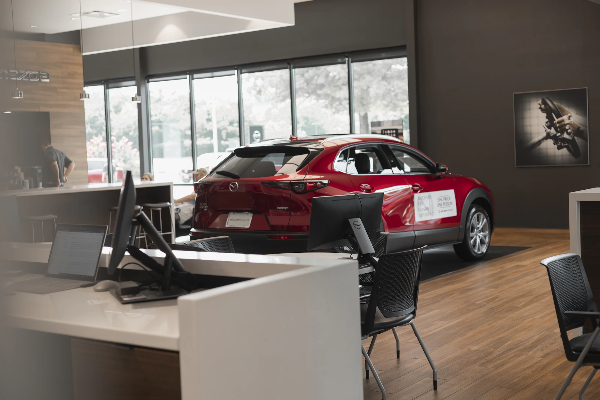 Inside a car dealership showroom — a North American automotive platform connecting dealers and buyers