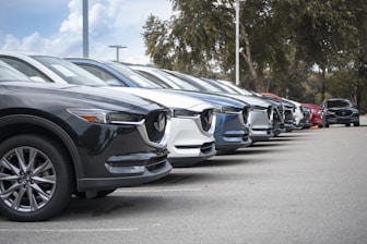 a row of parked cars in a parking lot