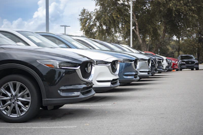 a row of parked cars in a parking lot