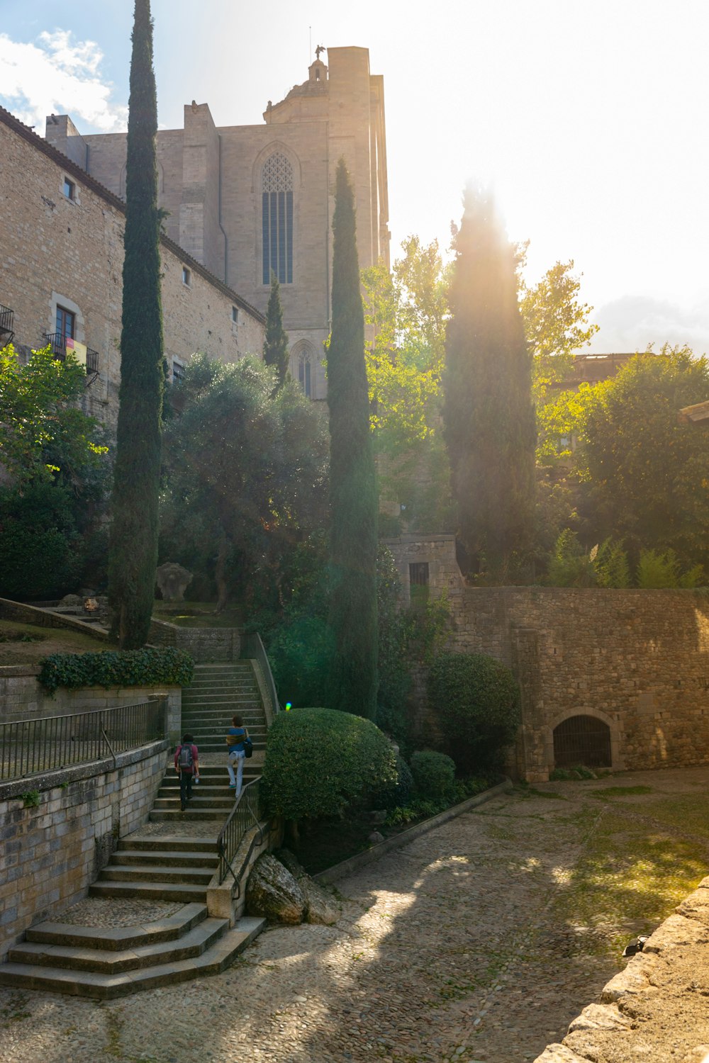 the sun shines on the steps leading to a church