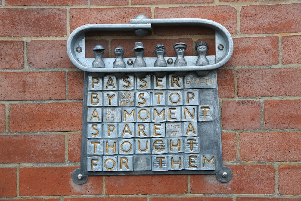 a metal sign on a brick wall that says passersby stop at women '