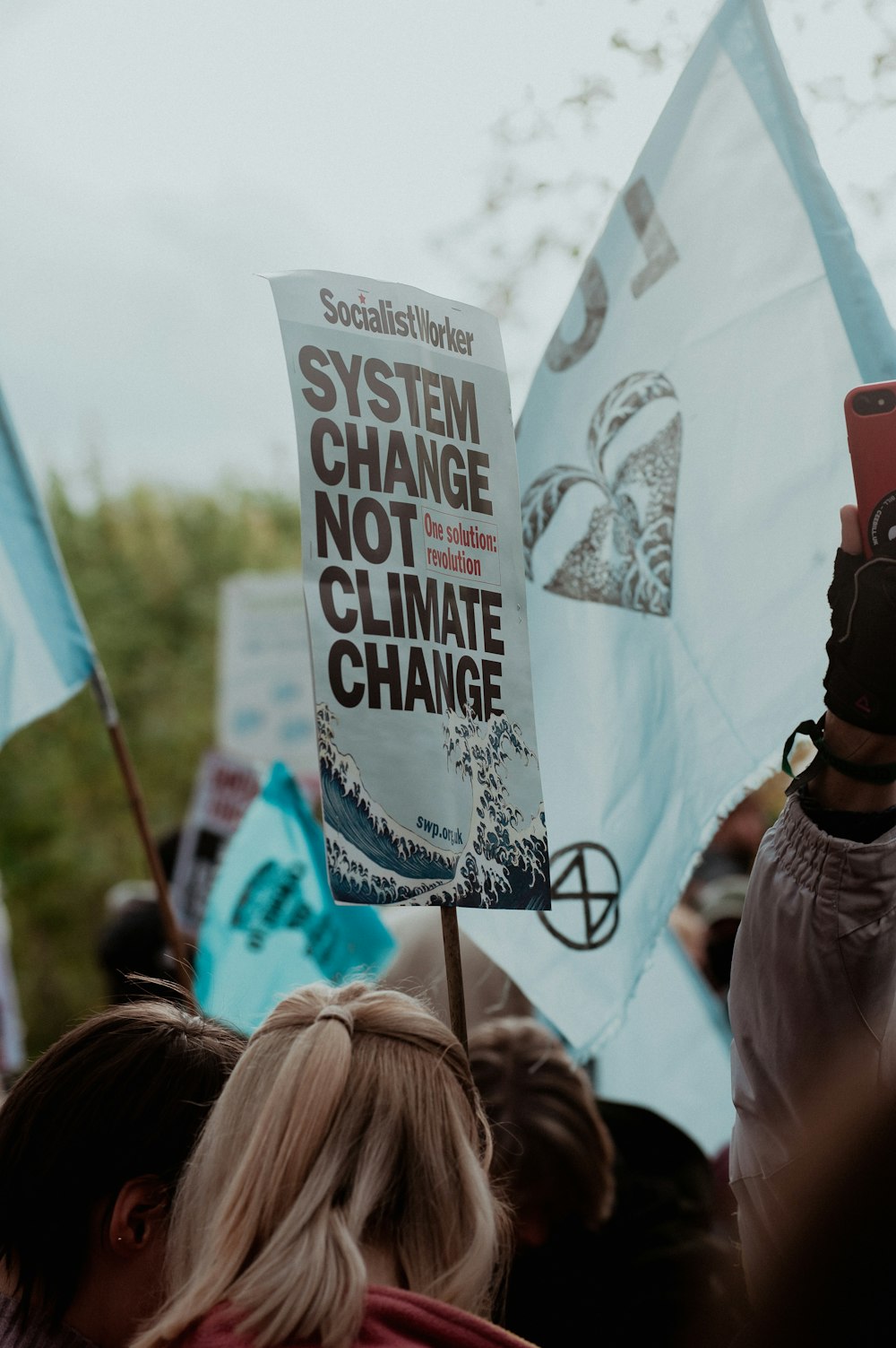 a group of people holding up protest signs