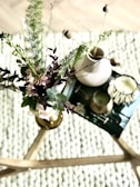 A rustic coffee table adorned with candles and coasters.