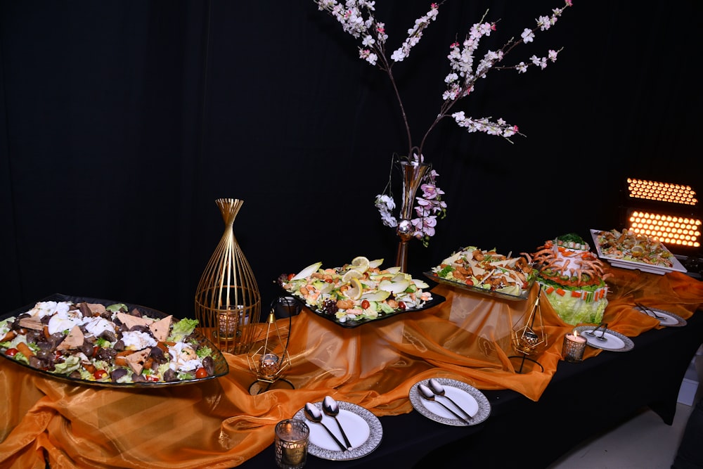 a buffet table with a variety of food on it