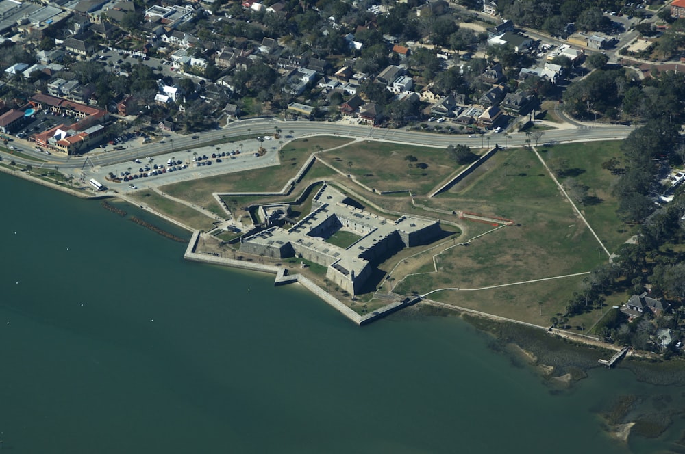 an aerial view of a fort on the water