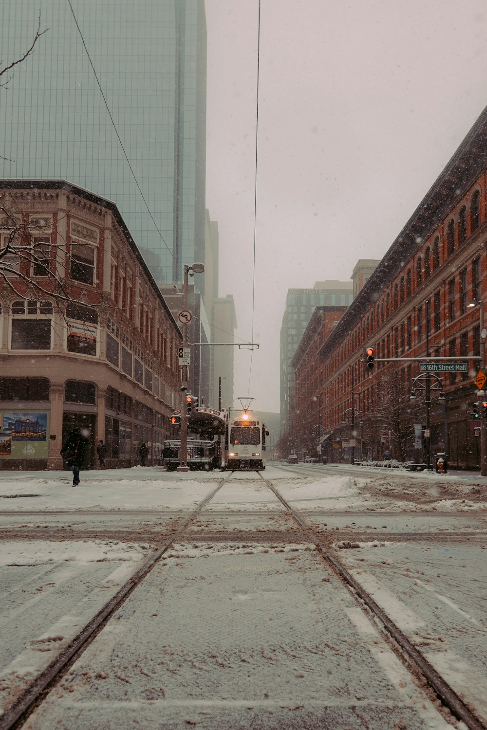 a city street with snow on the ground