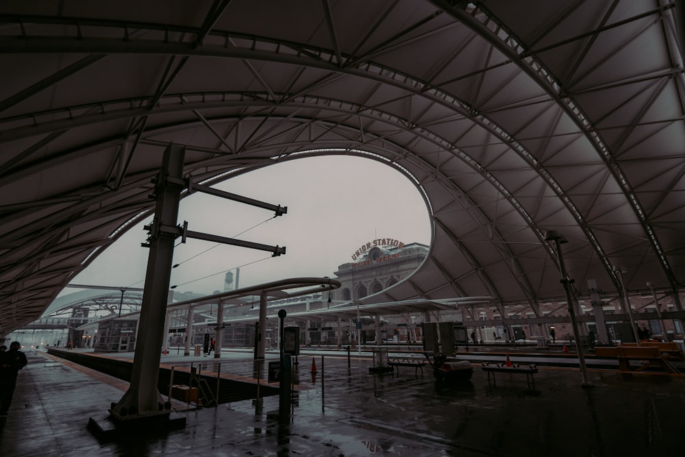 a train station with people waiting for the train