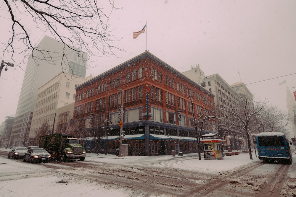 a large red brick building on a snowy day