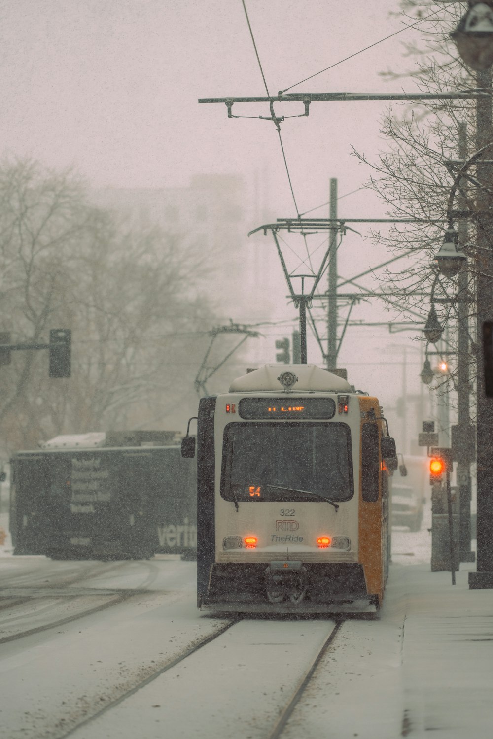 a train traveling down a snow covered train track