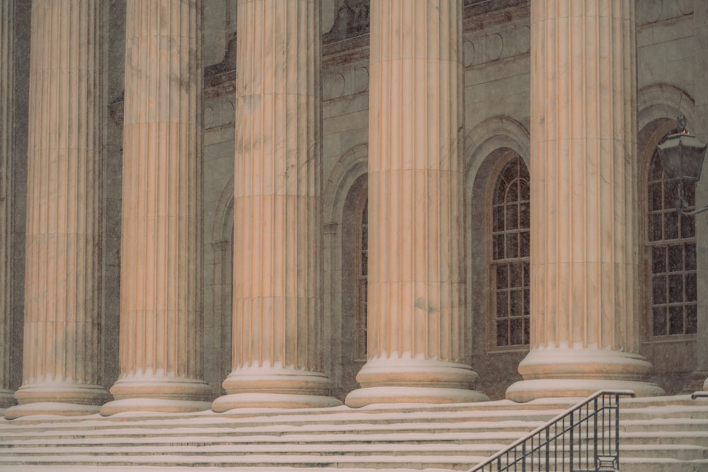 a man sitting on a bench in front of a building